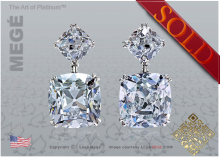 Antique cushion diamond earrings by Leon Megé