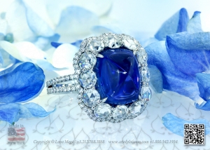 Sugarloaf unheated burma sapphire in intricate ring by Leon Mege