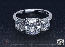 Three stone ring with three antique cushion diamonds by Leon Mege.