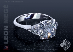 Three stone ring with modern sparkly cushion diamond by Leon Mege.
