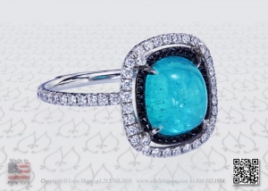 Neon blue Paraiba cab in a micro pave couture ring with black sapphires and diamonds by Leon Mege