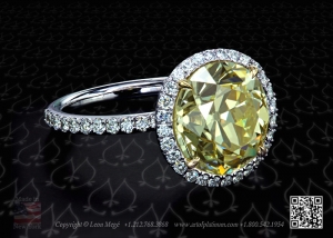Yellow  antique round diamond in a micro pave halo by Leon Mege