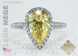 fancy yellow color pear shape diamond in a micro pave halo with white and yellow diamonds by Leon Mege