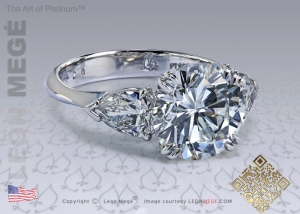 Three stone engagement ring with pear and round diamonds by Leon Megé