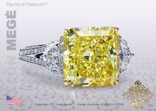  three-stone ring, featuring 6.65 carat radiant yellow diamond.