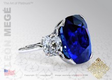 Platinum three stone ring featuring an exquisite natural sapphire with two cushion cut side stones by Leon Megé