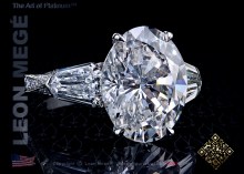 Three-stone ring, featuring 5.62 carat oval diamond by Leon Mege.