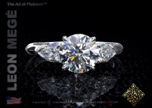 Three stone diamond ring featuring a round diamond by Leon Mege.