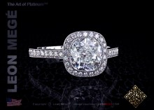 Millegrained halo engagement ring featuring a 2.01 carat cushion cut diamond by Leon Megé