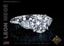  three-stone ring, featuring 2.20 carat round diamond.