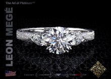 Three stone engagement ring featuring a round cut diamond by Leon Mege.