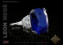 Custom three stone right hand ring featuring a natural 24.00 carat cushion cut blue sapphire by Leon Megé
