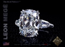 Three stone engagement ring with a 9.00 carat cushion cut diamond and tapered bullet side stones by Leon Megé.
