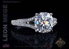 Split shank solitaire engagement ring featuring a cushion cut diamond and micro pave by Leon Megé