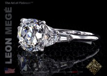 Five stones ring featuring a True Antique cushion diamond by Leon Mege.