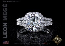 Halo engagement ring featuring a 3.01 carat antique cushion diamond by Leon Mege.