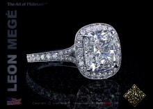Halo engagement ring featuring antique cushion diamond by Leon Mege.